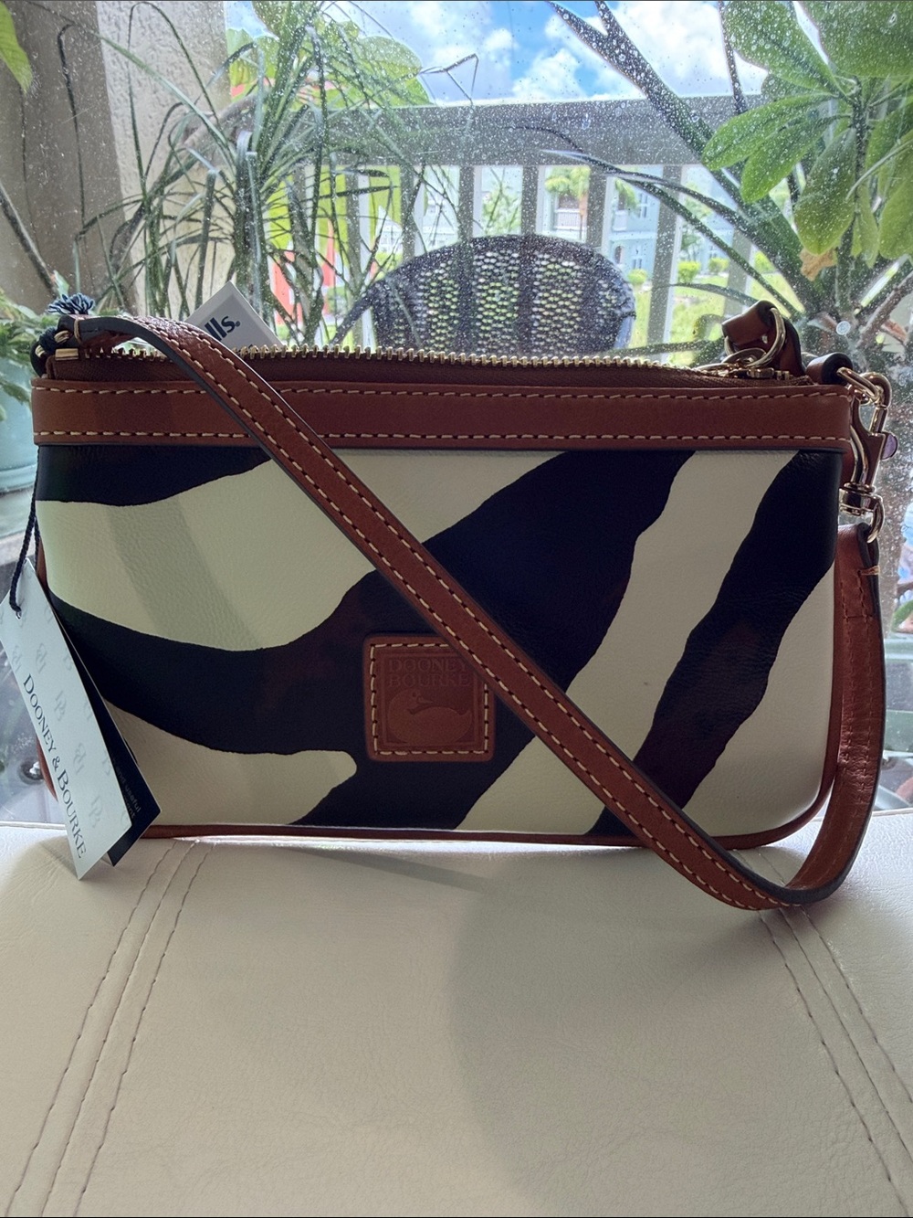 Dooney & Bourke Black and White Zebra-Print wristlet with Brown Trim